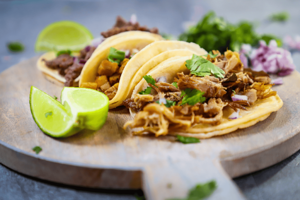 a photo of street tacos on a cutting board